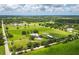 Aerial view of stunning acreage with a house and barn at 3100 Lena Ln, Sarasota, FL 34240