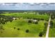 An aerial view of acreage with a pond and horse facilities at 3100 Lena Ln, Sarasota, FL 34240