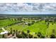 Aerial shot of acreage with trees, pond, and outbuildings at 3100 Lena Ln, Sarasota, FL 34240