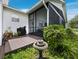 The outdoor screened-in porch allows homeowners to enjoy nature while relaxing at home at 3100 Lena Ln, Sarasota, FL 34240