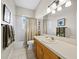 Bathroom with a tub/shower combination, vanity, and neutral tile flooring at 3100 Lena Ln, Sarasota, FL 34240
