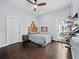 Charming bedroom with hardwood floors, ceiling fan, and access to the outdoors at 3100 Lena Ln, Sarasota, FL 34240
