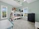 Bright ' bedroom with a bunk bed, ceiling fan, and ample natural light at 3100 Lena Ln, Sarasota, FL 34240