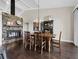 Dining room with fireplace and view to the kitchen area at 3100 Lena Ln, Sarasota, FL 34240