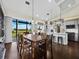 Farmhouse kitchen with wooden table, gray cabinets, and stainless steel appliances at 3100 Lena Ln, Sarasota, FL 34240