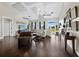 Bright, open living room with high ceilings and large windows overlooking the pasture at 3100 Lena Ln, Sarasota, FL 34240