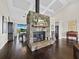 Living room with stone fireplace and open to the dining and kitchen area at 3100 Lena Ln, Sarasota, FL 34240