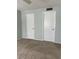 Neutral bedroom with multiple doors at 3245 Beneva Rd # 203, Sarasota, FL 34232