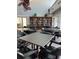 Amenity center including a library with tables and chairs for residents at 3245 Beneva Rd # 203, Sarasota, FL 34232
