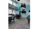 Relaxing community room with bar, television, and recreational opportunities at 3245 Beneva Rd # 203, Sarasota, FL 34232