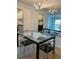 Bright dining room featuring mirrored accent wall and modern table with seating at 3245 Beneva Rd # 203, Sarasota, FL 34232