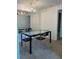 Elegant dining area with a mirrored wall, stylish chandelier, and seating for four at 3245 Beneva Rd # 203, Sarasota, FL 34232