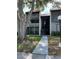 Charming condo with tiled roof, screened porch, and a well-maintained front yard at 3245 Beneva Rd # 203, Sarasota, FL 34232