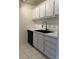 Well-equipped kitchen with a dishwasher, tiled floor, and plenty of storage at 3245 Beneva Rd # 203, Sarasota, FL 34232