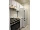 Updated kitchen featuring stainless steel appliances, modern countertops, and ample storage at 3245 Beneva Rd # 203, Sarasota, FL 34232