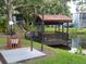 Scenic gazebo by the pond with a grill for resident use at 3245 Beneva Rd # 203, Sarasota, FL 34232