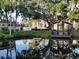 Scenic pond view with a wooden gazebo perfect for relaxation at 3245 Beneva Rd # 203, Sarasota, FL 34232