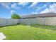 Well-maintained backyard with a privacy fence, green grass, and landscaped border, offering a peaceful outdoor space at 327 40Th W Ct, Palmetto, FL 34221