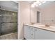 Bathroom featuring double sinks, and a walk-in shower with glass door at 327 40Th W Ct, Palmetto, FL 34221