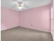 Empty bedroom with neutral carpet, ceiling fan, and one window at 327 40Th W Ct, Palmetto, FL 34221
