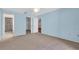 Spacious bedroom with light blue walls, carpeted floors, and a ceiling fan at 327 40Th W Ct, Palmetto, FL 34221