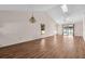 Large living room with wood flooring, high ceilings, and a skylight at 327 40Th W Ct, Palmetto, FL 34221
