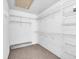 Walk-in closet with wire shelving and carpet flooring at 327 40Th W Ct, Palmetto, FL 34221