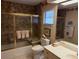 Cozy bathroom with a glass-enclosed shower, neutral color palette, and a well-lit vanity at 3764 Torrey Pines Blvd, Sarasota, FL 34238