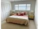Cozy bedroom with a queen-sized bed, ample closet space, and neutral tones at 3764 Torrey Pines Blvd, Sarasota, FL 34238