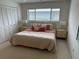 Inviting bedroom with a large window, plush bed, and ample closet space at 3764 Torrey Pines Blvd, Sarasota, FL 34238
