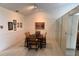 Dining room with a table and seating for six, featuring a mirrored wall at 3764 Torrey Pines Blvd, Sarasota, FL 34238