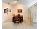 Dining area with stylish table set, bright lighting, and mirrored wall at 3764 Torrey Pines Blvd, Sarasota, FL 34238
