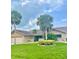 Charming single-story home featuring lush landscaping and a well-manicured front lawn at 3764 Torrey Pines Blvd, Sarasota, FL 34238