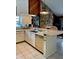 Bright kitchen featuring white cabinets, tile backsplash, and modern appliances at 3764 Torrey Pines Blvd, Sarasota, FL 34238