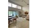 Spacious living room with tile floors, comfortable seating, and sliding glass doors to the outdoors at 3764 Torrey Pines Blvd, Sarasota, FL 34238
