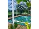 Refreshing screened-in pool area with a beautiful view of the golf course at 3764 Torrey Pines Blvd, Sarasota, FL 34238
