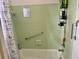 Relaxing bathtub shower combo with brushed silver hardware and decorative shower curtain at 3767 Pinstar Ter, North Port, FL 34287