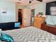 Bedroom features custom dresser and a view of closet and on suite bathroom at 3767 Pinstar Ter, North Port, FL 34287
