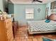 Tranquil bedroom features traditional dresser, neutral paint colors, and tiled floors at 3767 Pinstar Ter, North Port, FL 34287