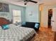 Bright bedroom area has a futon and leads to a large closet with custom organizers at 3767 Pinstar Ter, North Port, FL 34287