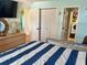 The bedroom is adjacent to the laundry, with an exterior door visible through the laundry room doorway at 3767 Pinstar Ter, North Port, FL 34287