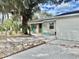 Charming single-story home with a well-maintained yard, a garage, and colorful front door at 3767 Pinstar Ter, North Port, FL 34287