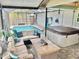 Enclosed patio offers a cozy seating area, hot tub, and refreshing pool at 3767 Pinstar Ter, North Port, FL 34287
