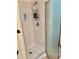 An inside shot of the shower, featuring a glass door and a shower caddy at 3767 Pinstar Ter, North Port, FL 34287