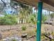 View of front yard showcasing lush landscaping from the home's porch at 3767 Pinstar Ter, North Port, FL 34287