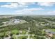 Aerial shot of property showcasing serene setting, surrounded by lush trees and neighborhood ponds at 3906 Twin Rivers Trl, Parrish, FL 34219