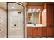 Walk-in shower with tile and shower head with modern style at 3906 Twin Rivers Trl, Parrish, FL 34219