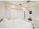 Bedroom featuring neutral colors, a ceiling fan, a large closet, and wood floors in hall at 3906 Twin Rivers Trl, Parrish, FL 34219
