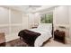 Neutral bedroom featuring natural light, a ceiling fan, and modern decor at 3906 Twin Rivers Trl, Parrish, FL 34219