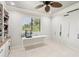 Bonus room featuring natural light, a ceiling fan, and a workspace at 3906 Twin Rivers Trl, Parrish, FL 34219